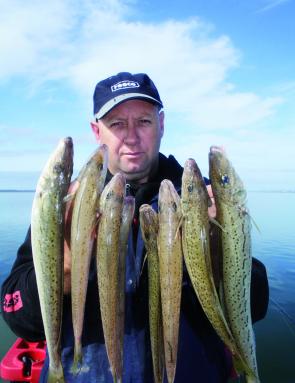 Colin displays a handful whiting caught on circle hooks.