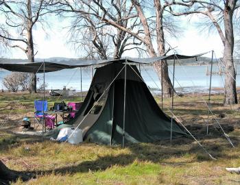 Camping at Arthurs Lake, Tasmania, the author supported the tent fly with a lot of poles and ropes, as strong winds were forecast.