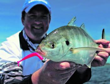 Good mate Blair Bryant with a sold silver trevally, caught while targeting flatties at Lake Tyers.
