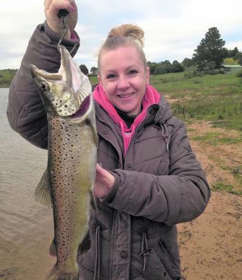 She hooked a great brown trout.