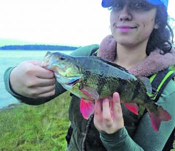 Eden Barlow with one of many nice redfin she has caught recently.