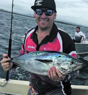 Dan Le Mura with a barrel of a mac tuna caught at South Reef. 