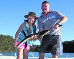 Andrew Grover and daughter with a  85cm flathead released back into the system. 
