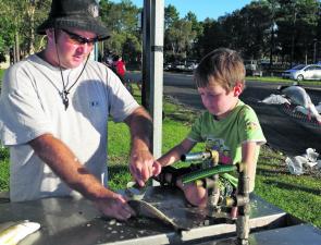 Russell Farley and young Luca clean some of the quality bream they caught at the new Evans Head boat ramp.