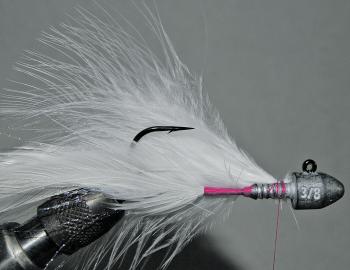 Cut the marabou so that it is long enough to extend a centimetre or two past the bend of the hook. You will probably want one or two marabou quills tied in on the far side of your hook with a series of thread wraps. A little vinyl cement on the thread wil
