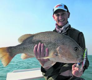 Adam Mcgloughlin with the rewards of a week camping on a remote river mouth, a big golden snapper!