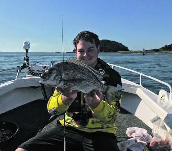 Chris Neville with a couple of bream from the lower Crookhaven River caught on live nippers.