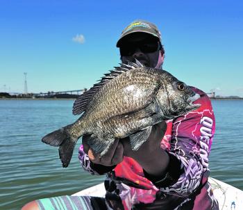 Craig Robertson showing a large pikey bream.