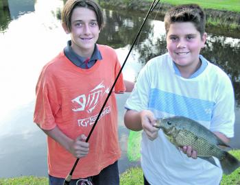 The Wardlaw lads enjoy catching tilapia: just look at those grins. 