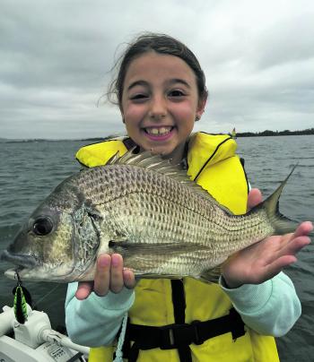 The author’s daughter with her PB bream caught recently. A solid fish that left her smiling for quite some time.