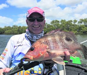 A decent golden snapper taken while fishing plastics in a deep hole.