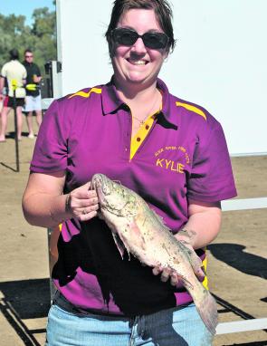 Kylie Dows with her catch at last year’s comp.